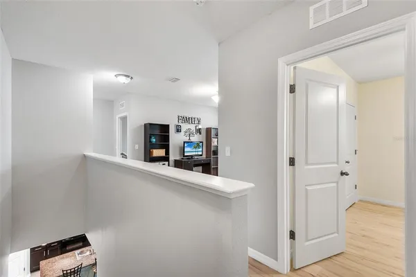 a view of a living room with a wooden floor