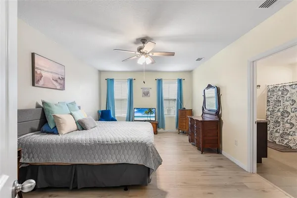 a living room with a bed furniture and a large window