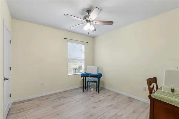 a workspace with furniture and chandelier
