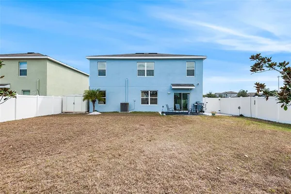 a view of a house with a yard and garage