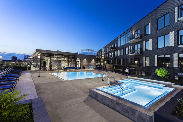 1025 West Addison Street, Unit 722 Chicago, IL 60613 - Photo 8 of 15 a view of a patio with swimming pool table and chairs