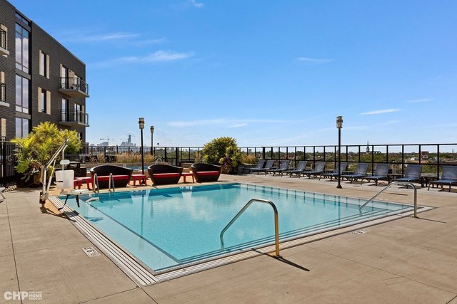 1025 West Addison Street, Unit 722 Chicago, IL 60613 - Photo 9 of 15 a view of a swimming pool with outdoor seating