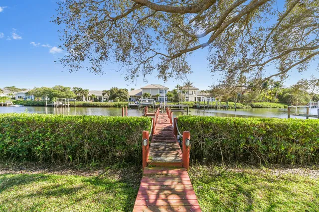 a living room with furniture a rug and white walls