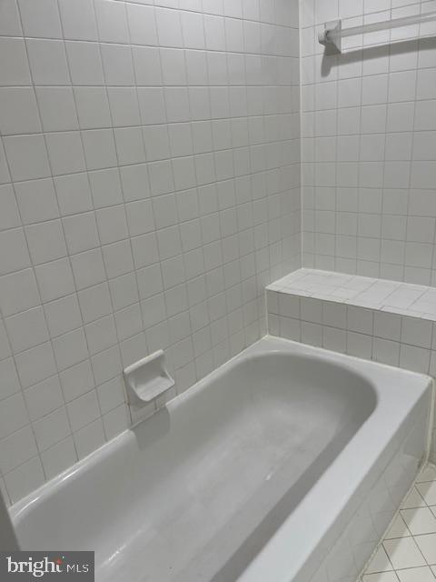 7907 Crows Nest Court, Unit 9342 Laurel, MD 20707 - Photo 2 of 4 a white bath tub sitting in a bathroom