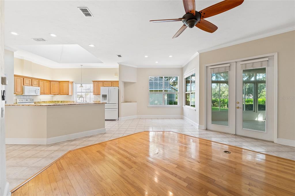 10526 Northwest 32nd Road Gainesville, FL 32606 - Photo 2 of 48 a large space with chandelier and wooden floors