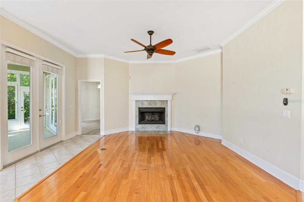 10526 Northwest 32nd Road Gainesville, FL 32606 - Photo 21 of 48 wooden floor in an empty room with a window