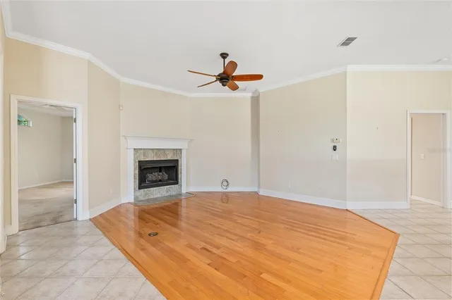 a view of an empty room with a fireplace