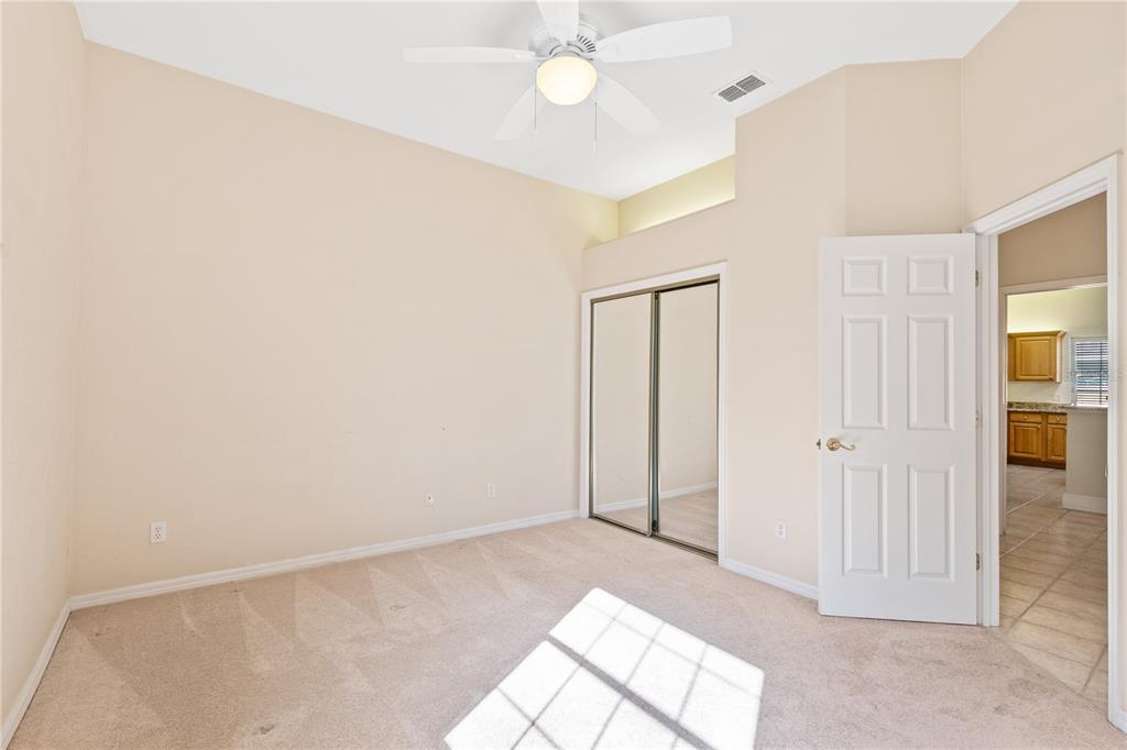 10526 Northwest 32nd Road Gainesville, FL 32606 - Photo 23 of 48 an empty room with fan and entrance