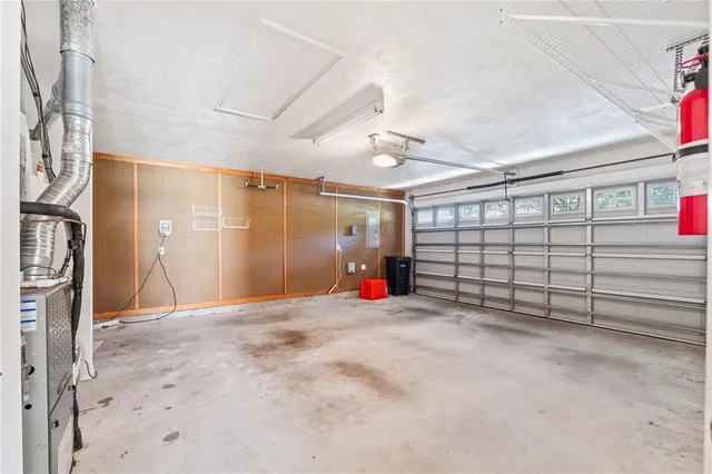 an empty room with closet and windows