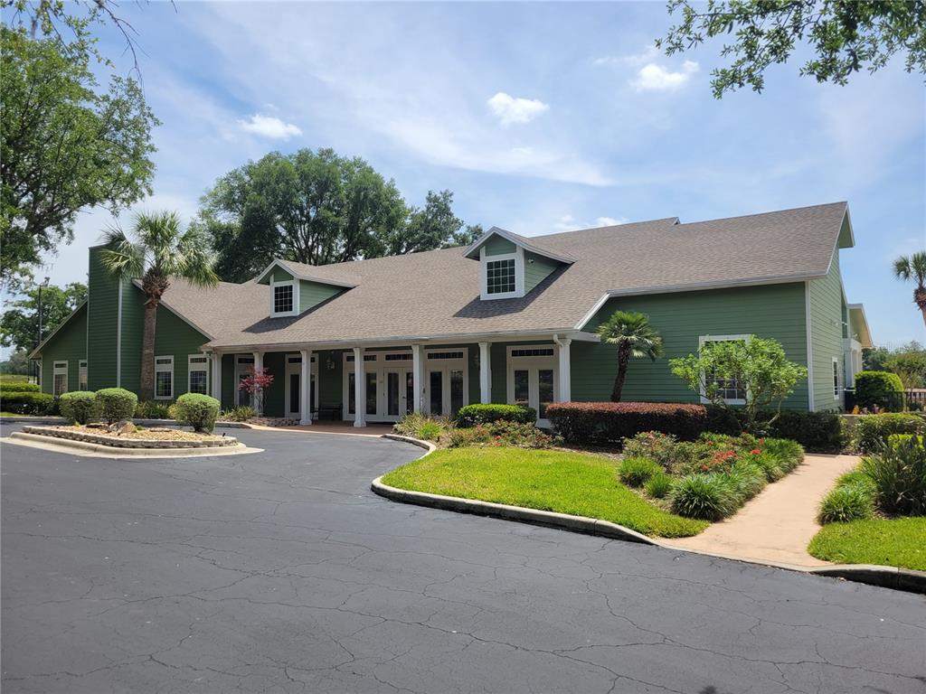 10526 Northwest 32nd Road Gainesville, FL 32606 - Photo 45 of 48 a front view of a house with yard and green space