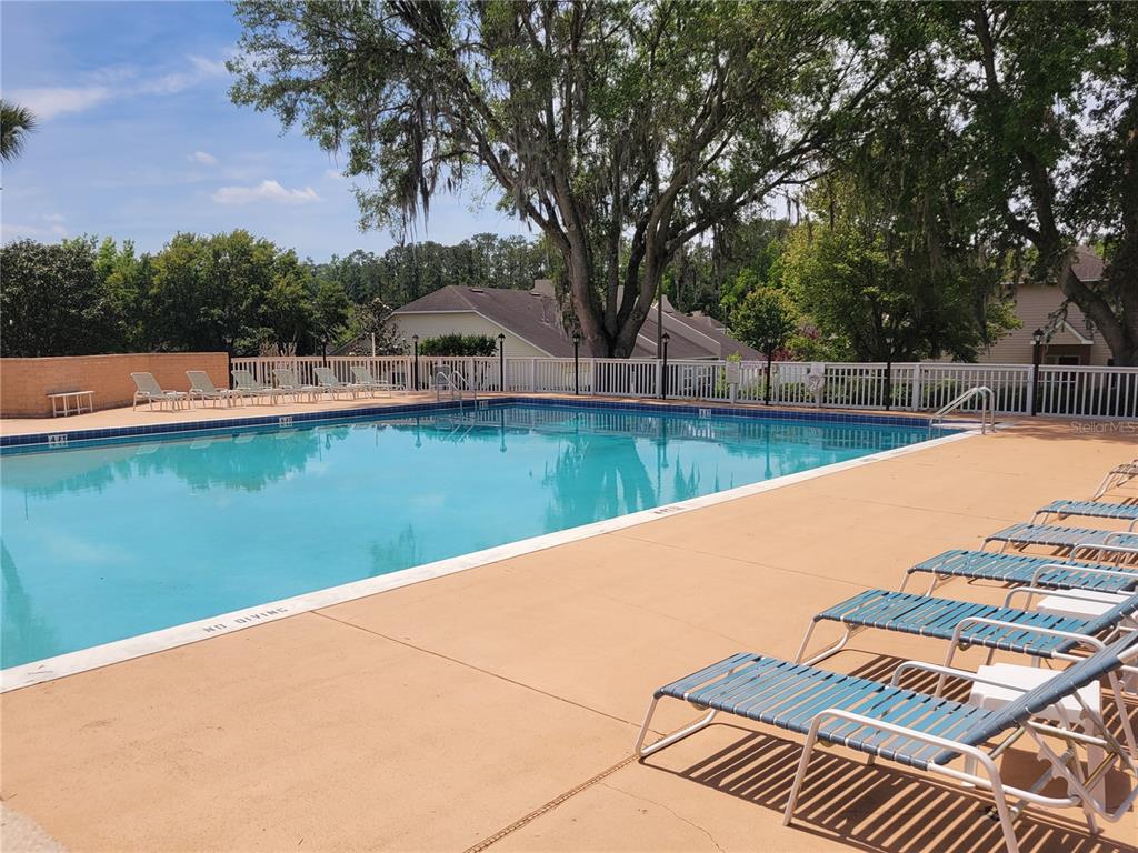 10526 Northwest 32nd Road Gainesville, FL 32606 - Photo 46 of 48 a view of a swimming pool with a lake view