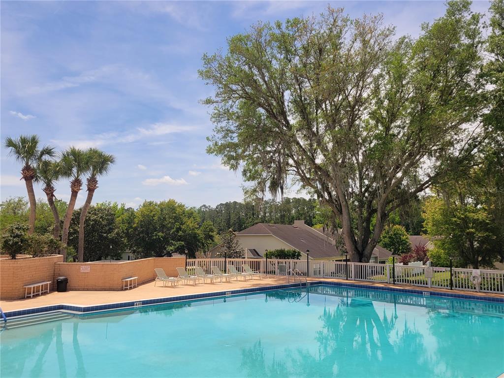 10526 Northwest 32nd Road Gainesville, FL 32606 - Photo 47 of 48 a view of a house with swimming pool and sitting area
