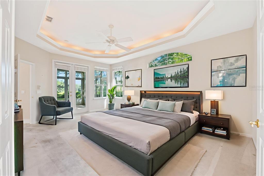 10526 Northwest 32nd Road Gainesville, FL 32606 - Photo 5 of 48 a spacious bedroom with a bed and large windows