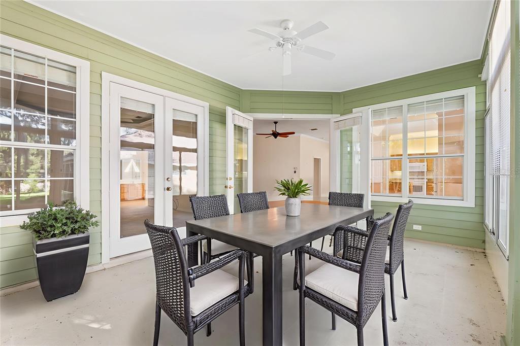 10526 Northwest 32nd Road Gainesville, FL 32606 - Photo 6 of 48 a view of a dining room with furniture window and wooden floor