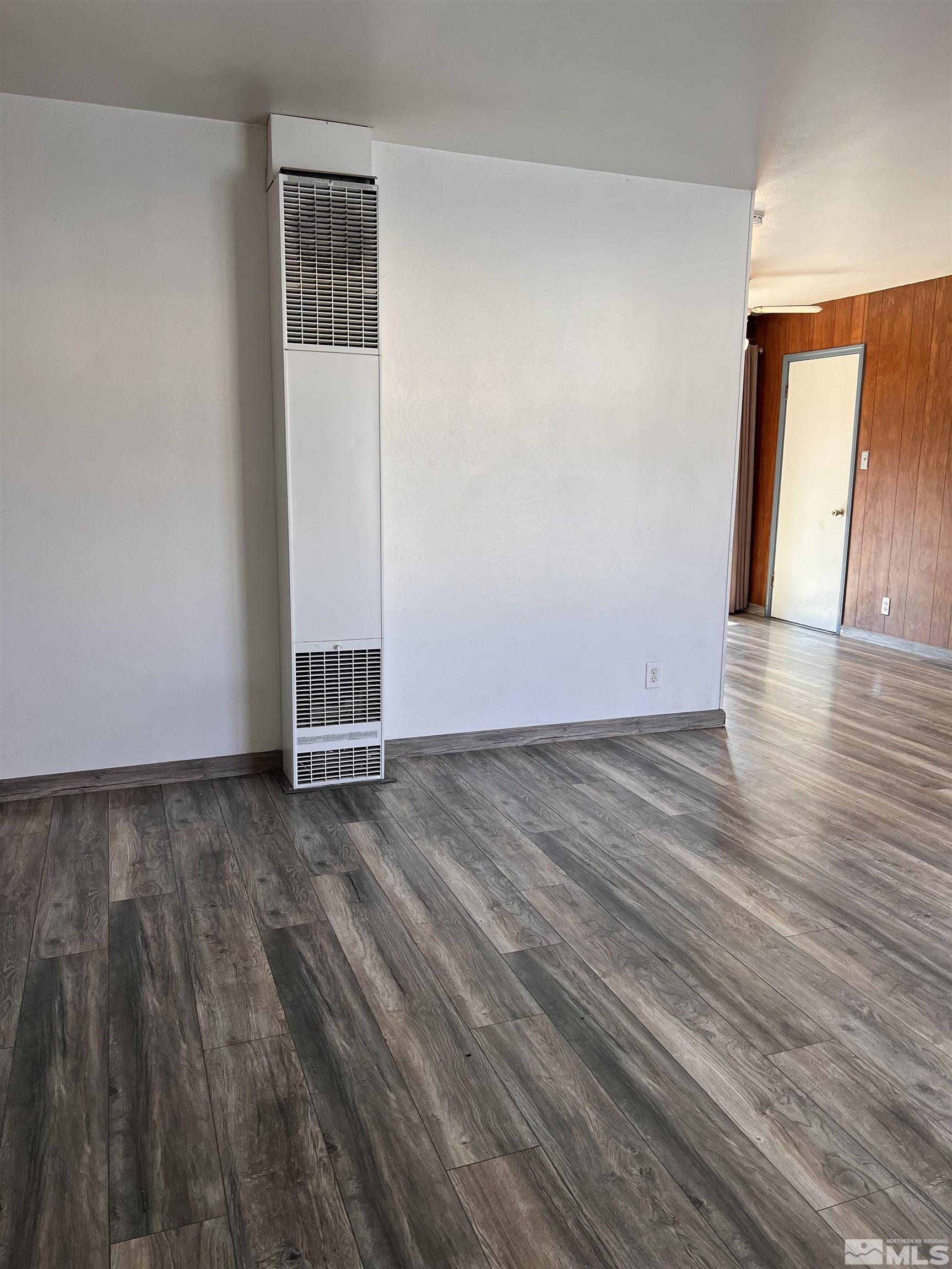 1425 Keystone Avenue Reno, NV 89503 - Photo 2 of 12 an empty room with wooden floor and windows