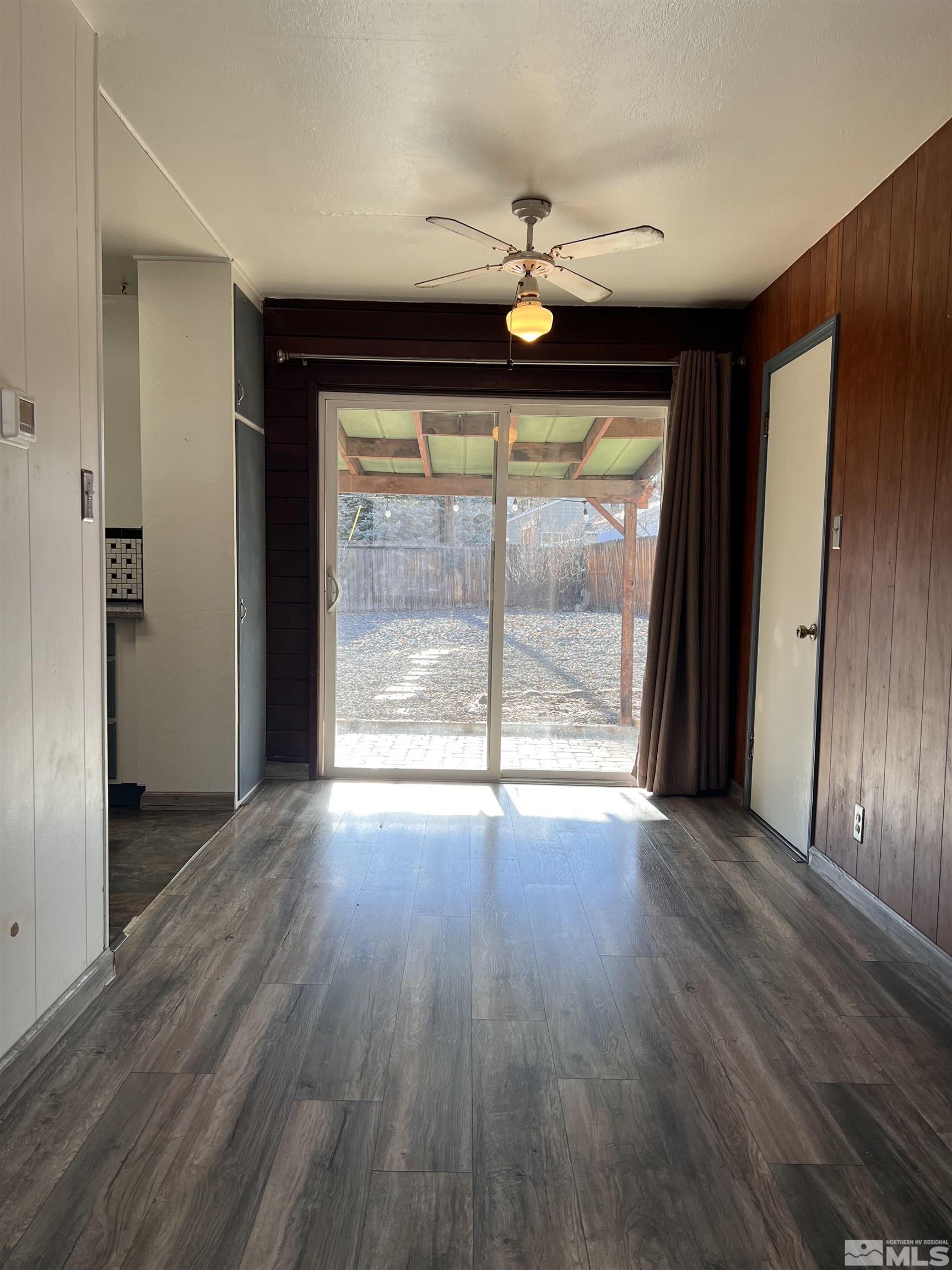 1425 Keystone Avenue Reno, NV 89503 - Photo 4 of 12 an empty room with wooden floor and windows