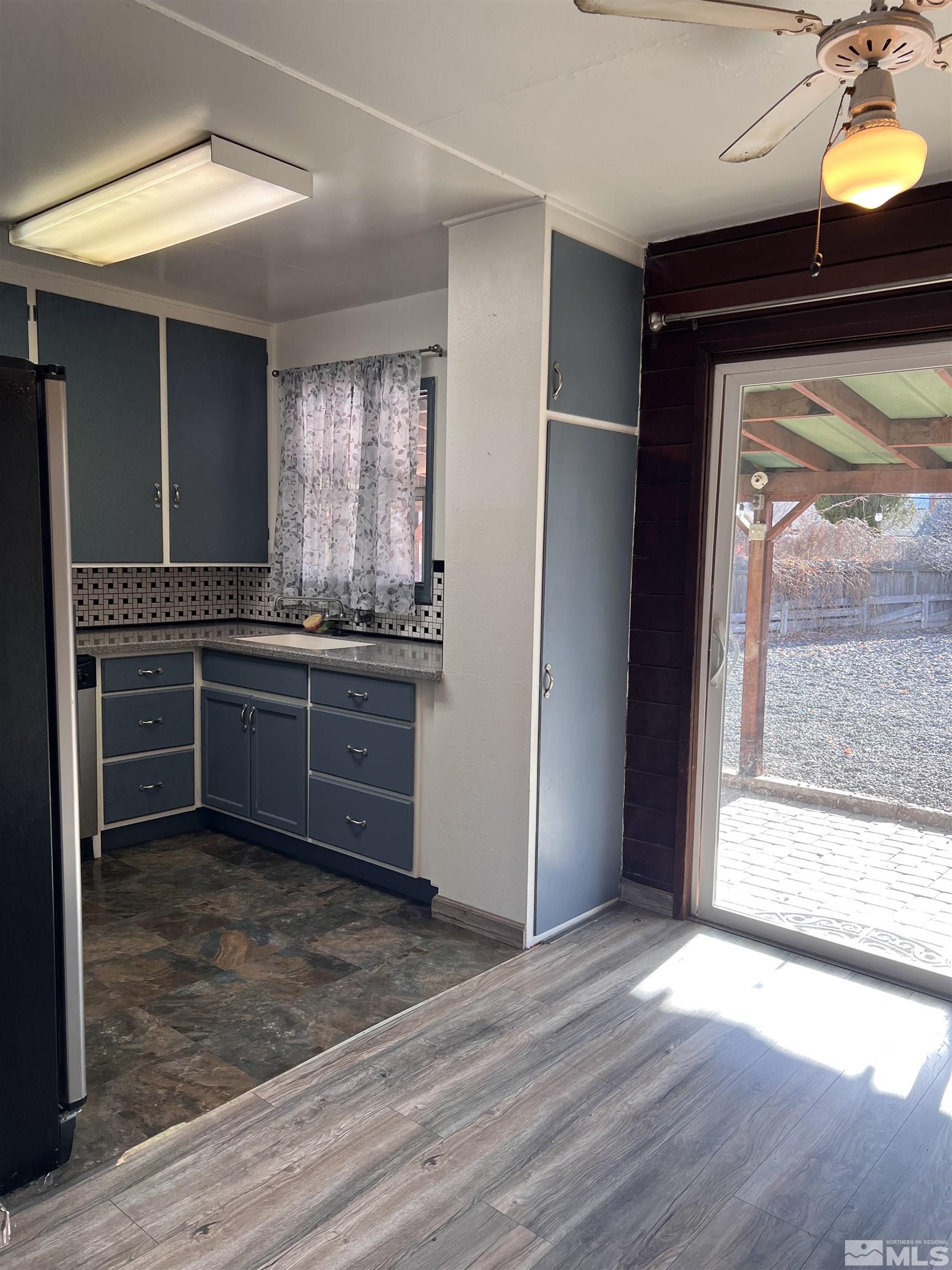 1425 Keystone Avenue Reno, NV 89503 - Photo 5 of 12 a kitchen with stainless steel appliances granite countertop a stove a sink and a refrigerator