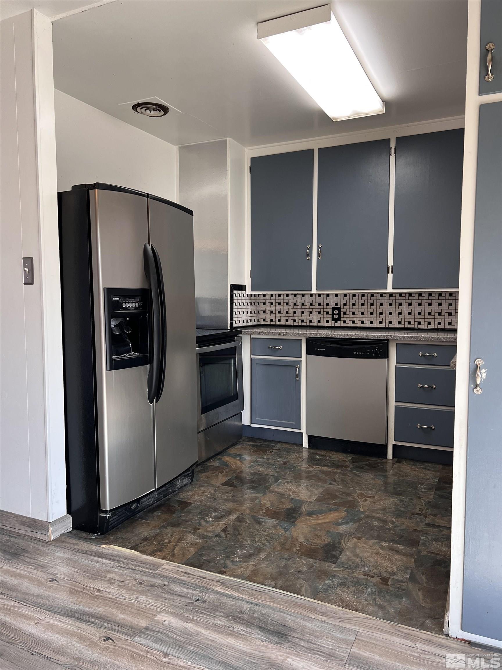 1425 Keystone Avenue Reno, NV 89503 - Photo 6 of 12 a kitchen with stainless steel appliances granite countertop a refrigerator and a sink