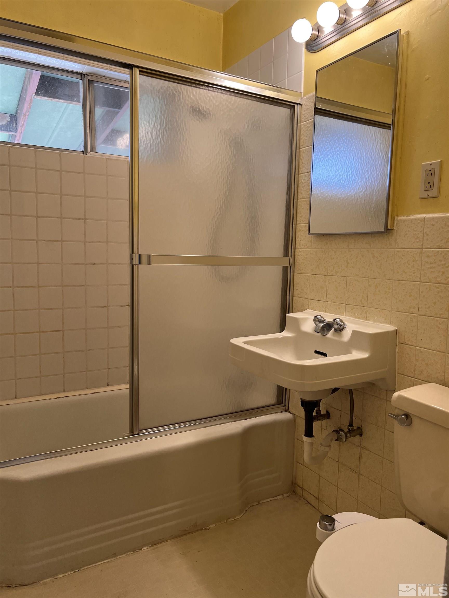 1425 Keystone Avenue Reno, NV 89503 - Photo 7 of 12 a bathroom with a sink a toilet and shower