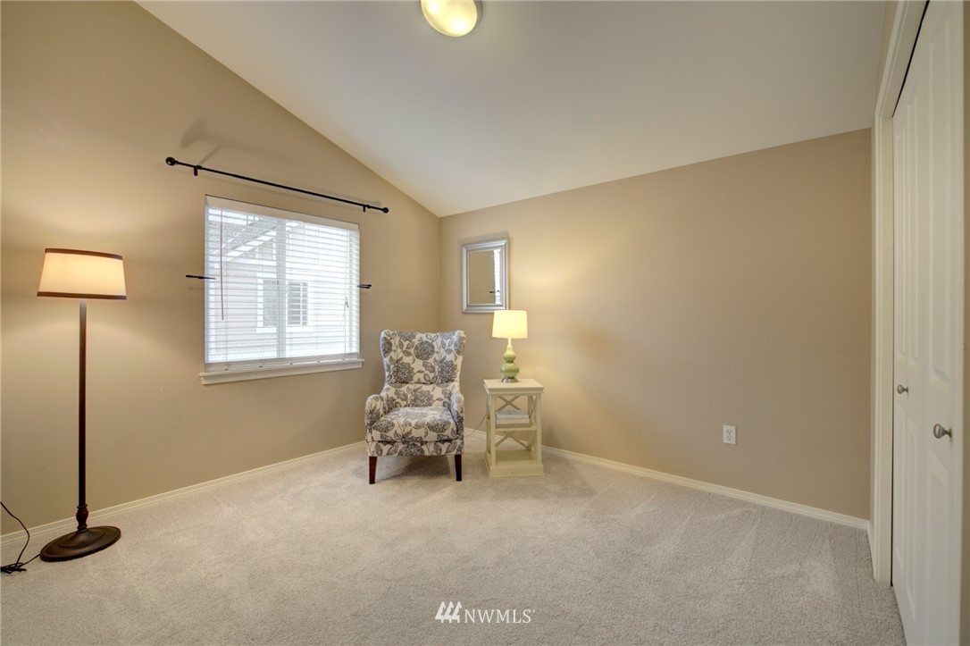 10136 Holman Road Northwest, Unit A Seattle, WA 98133 - Photo 14 of 27 a living room with furniture and a window