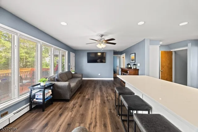 a living room with furniture and a large window