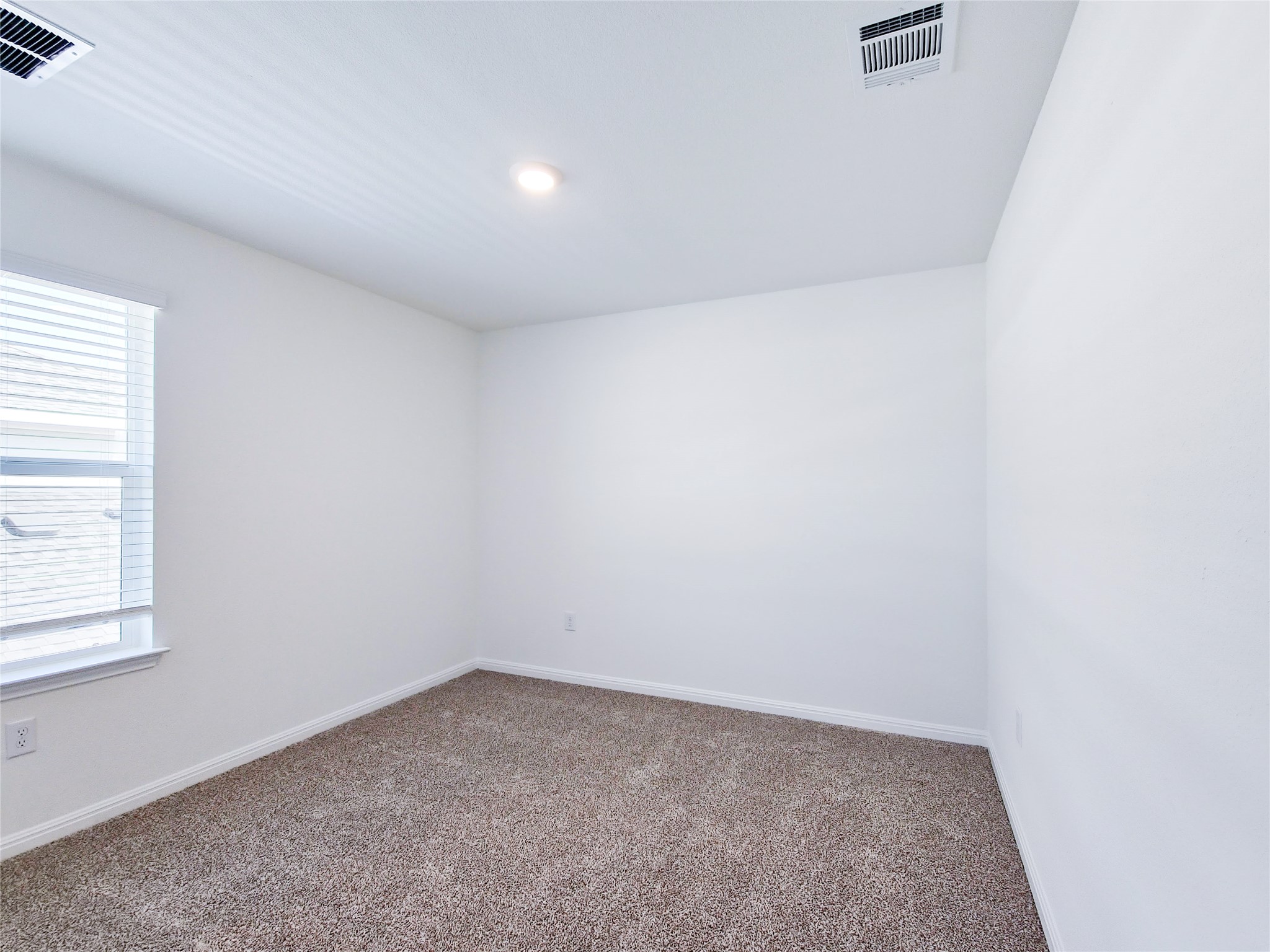 2313 March Hare Trace Leander, TX 78641 - Photo 28 of 30 Spare room featuring carpet and baseboards