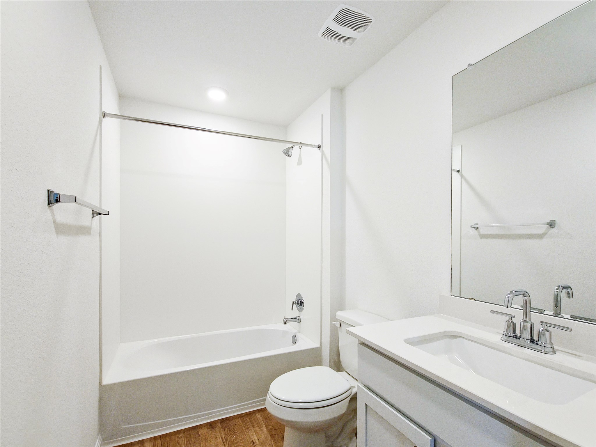 2313 March Hare Trace Leander, TX 78641 - Photo 6 of 30 Bathroom featuring vanity, light wood finished floors, and shower / bath combination