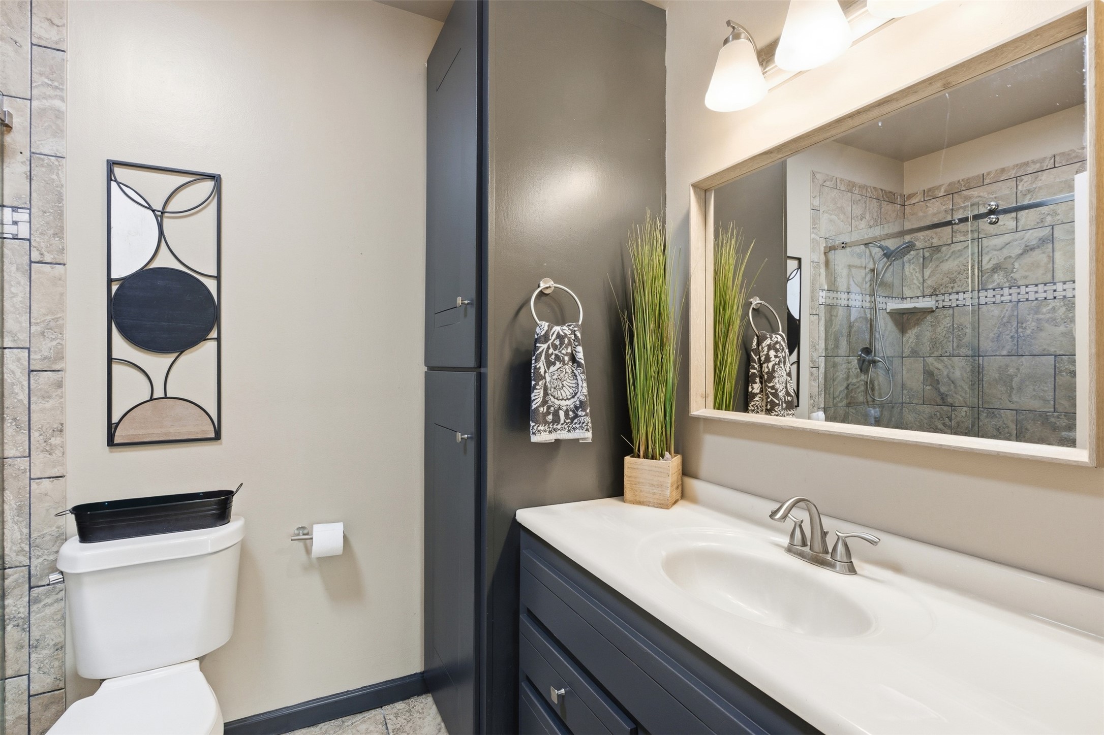1726 13th Street Hempstead, TX 77445 - Photo 13 of 40 a bathroom with a toilet a sink and mirror