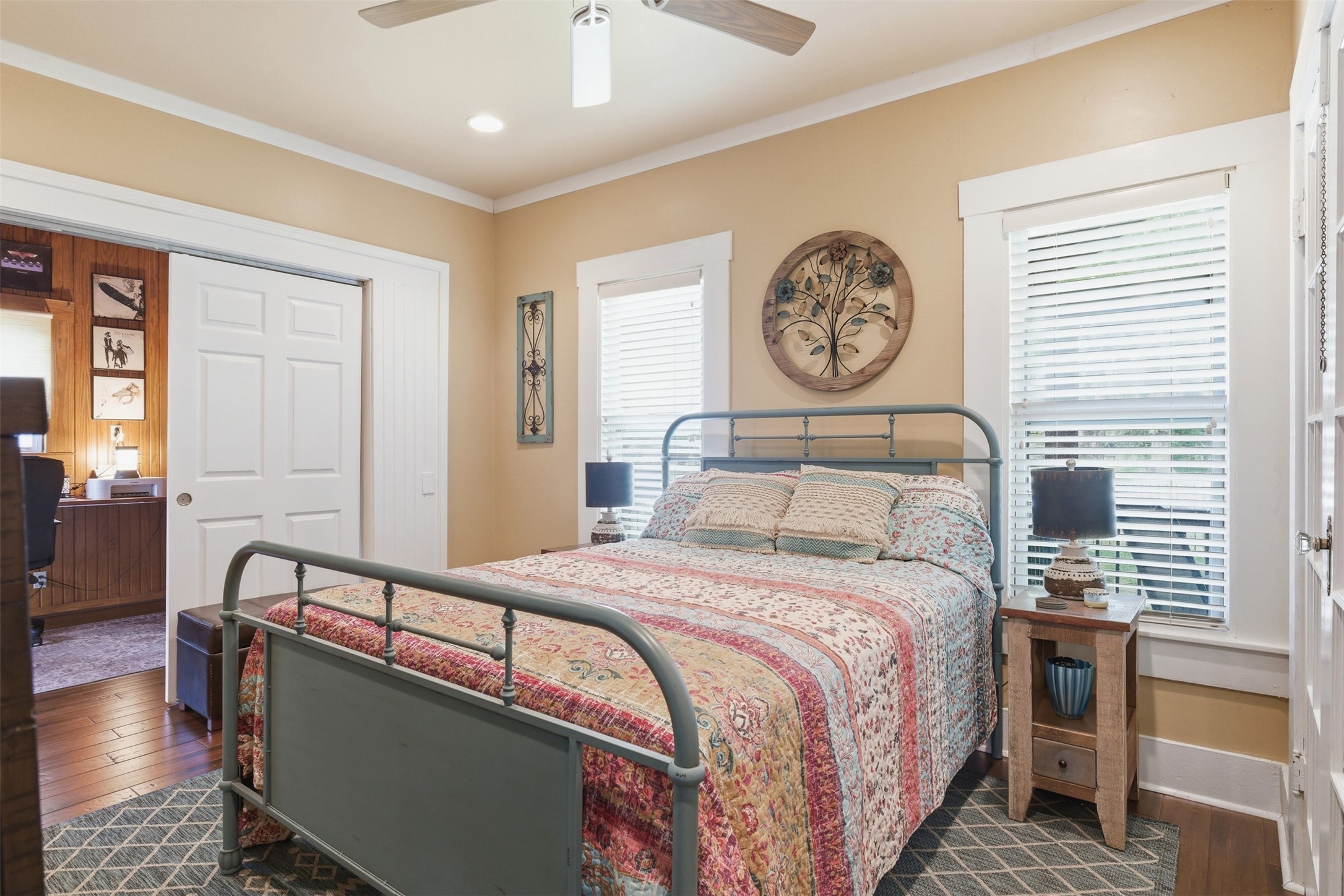 1726 13th Street Hempstead, TX 77445 - Photo 16 of 40 a bedroom with a bed and a chandelier