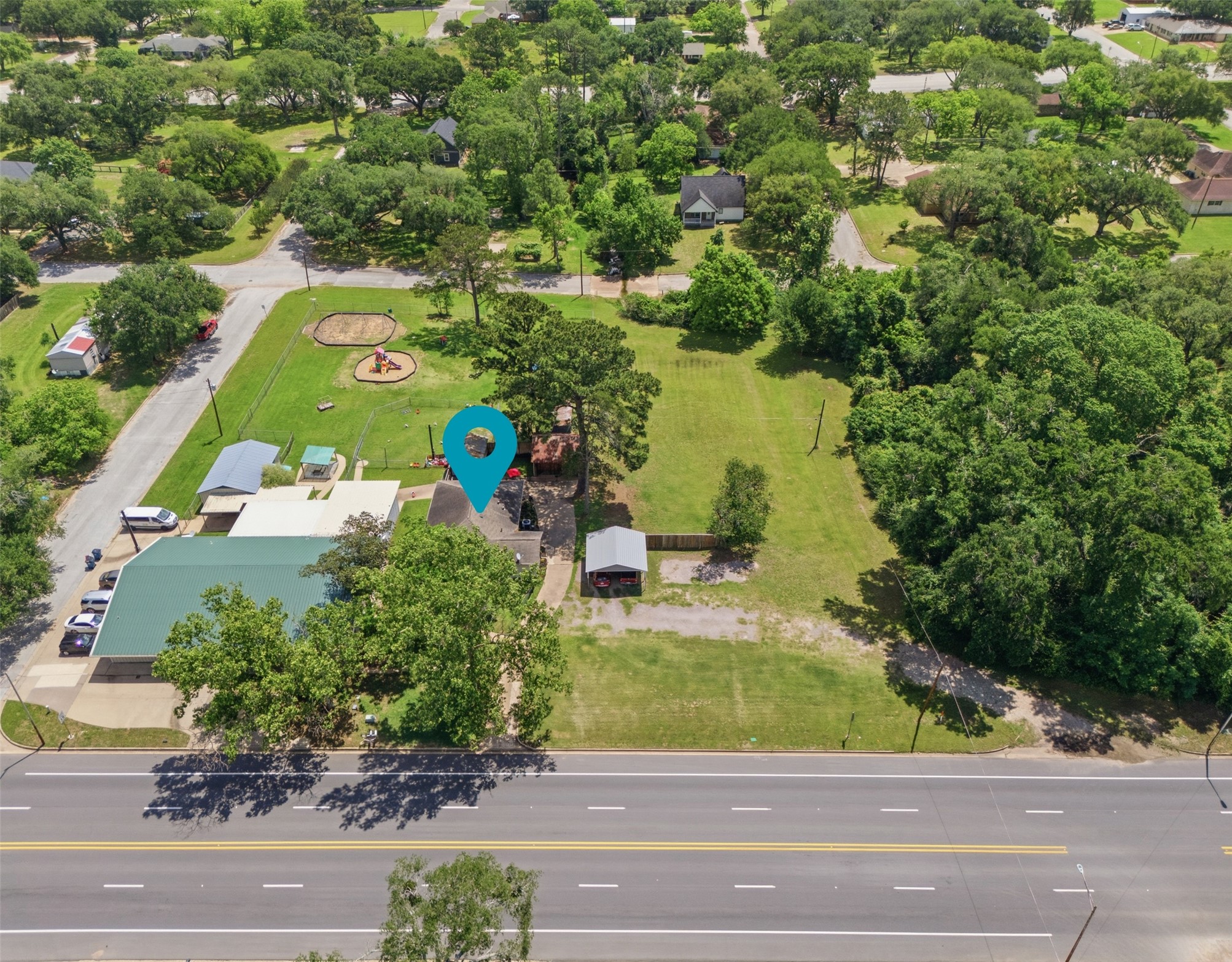 1726 13th Street Hempstead, TX 77445 - Photo 30 of 40 an aerial view of a house with a yard basket ball court and outdoor seating