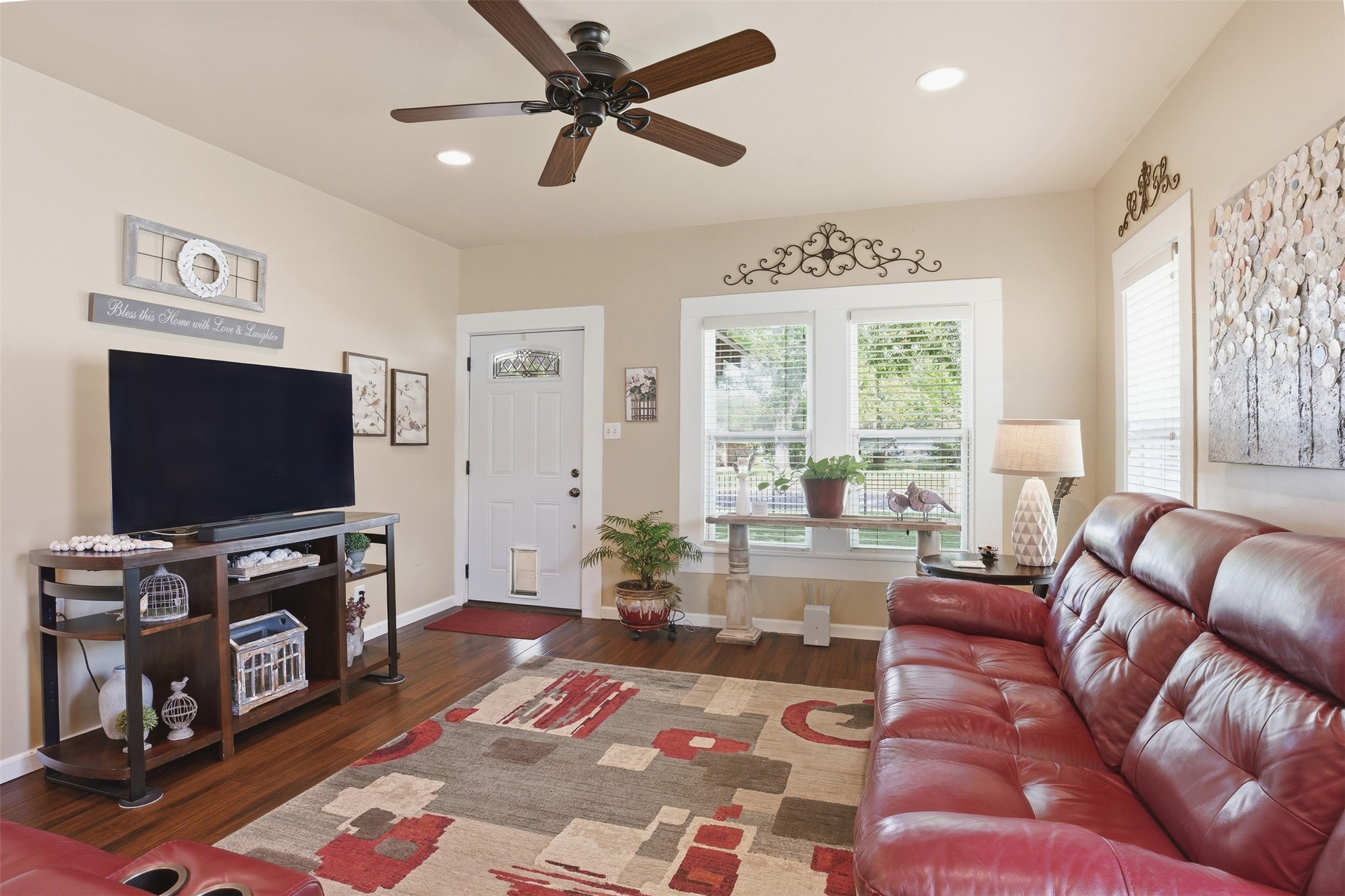 1726 13th Street Hempstead, TX 77445 - Photo 6 of 40 a living room with furniture and a flat screen tv