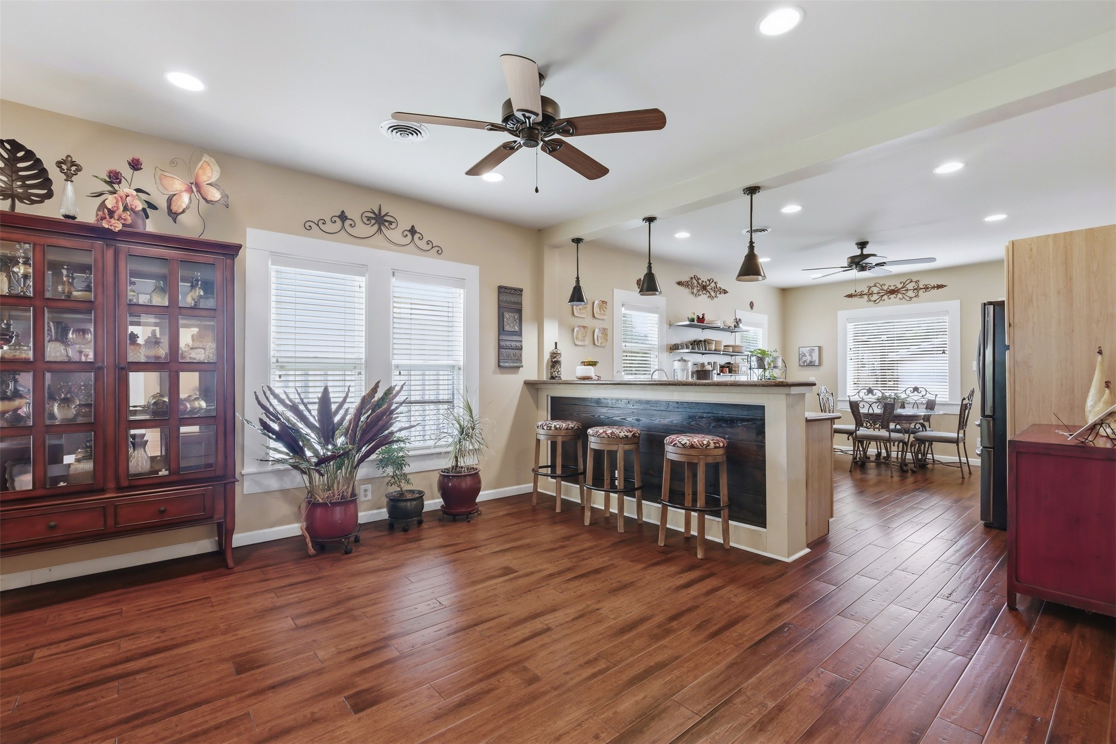 1726 13th Street Hempstead, TX 77445 - Photo 7 of 40 a living room with stainless steel appliances kitchen island granite countertop furniture wooden floor and a view of kitchen