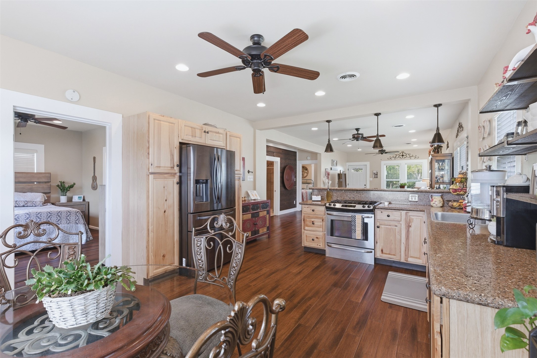 1726 13th Street Hempstead, TX 77445 - Photo 10 of 40 a living room with stainless steel appliances kitchen island furniture and a view of kitchen
