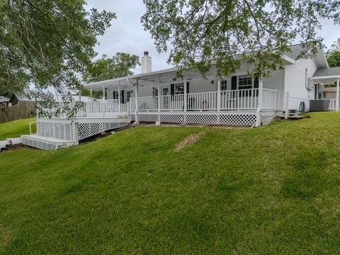 483 Riverside Drive Palacios, TX 77465 - Photo 38 of 41 a view of a house with a yard and deck