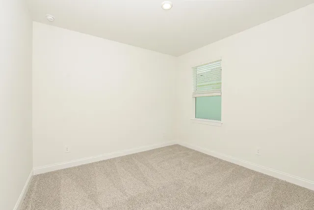 a bathroom with a sink a toilet and a shower