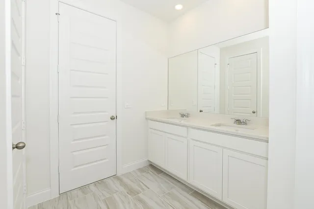 a kitchen with a refrigerator stove and cabinets