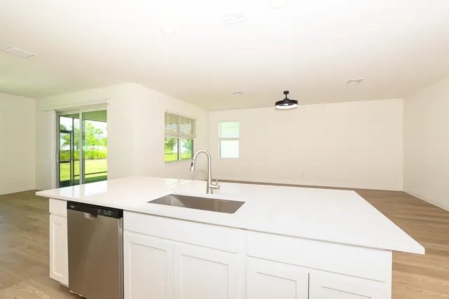 a swimming pool with an outdoor seating and a yard