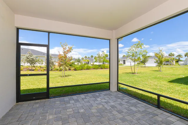 a view of a lake with houses in the back