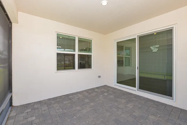 a view of a swimming pool with a yard