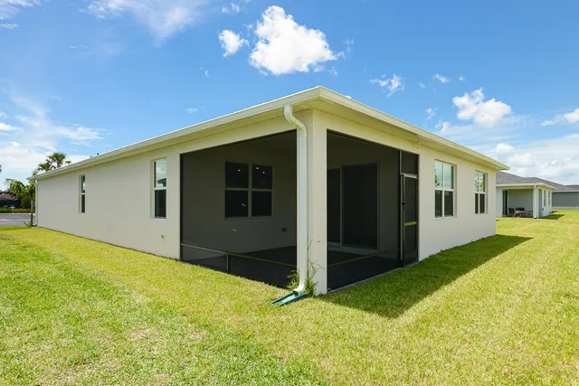 a view of a street with a flower garden