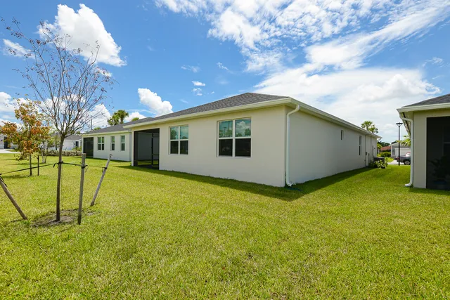 a view of a lake with houses in the back