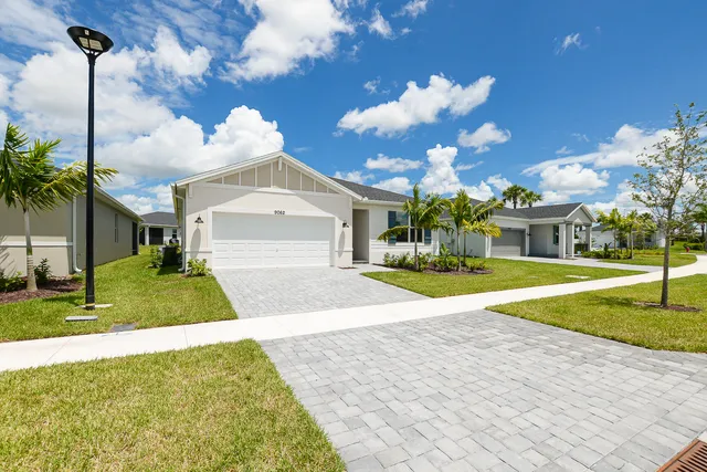 a view of a house with basketball court