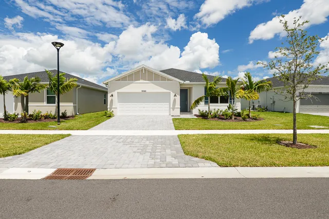 a front view of house with small garden