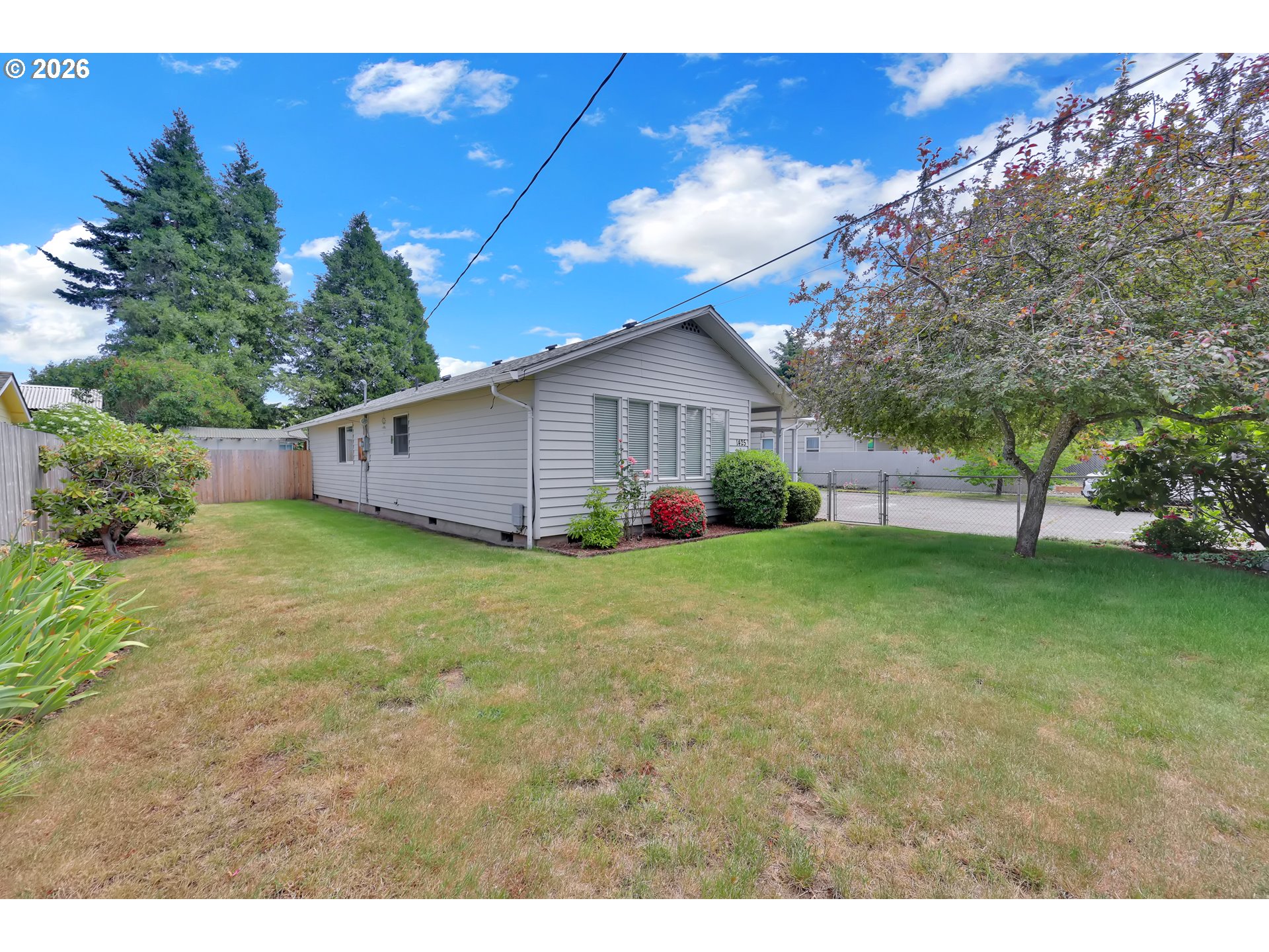 1425 Taney Street Eugene, OR 97402 - Photo 31 of 34 a view of an house with backyard space and garden