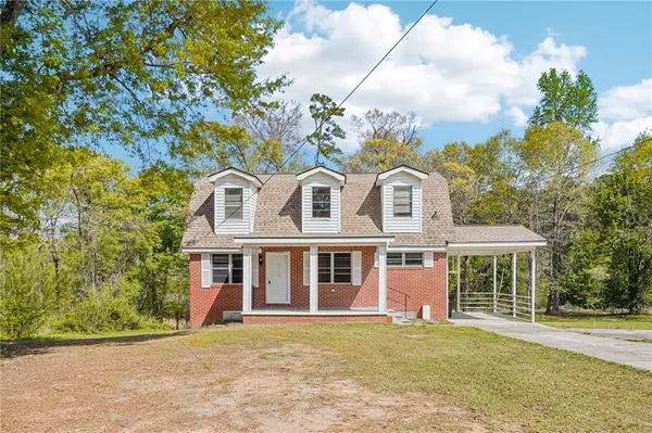 front view of a house with a garden