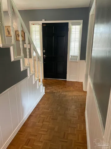 a spacious bedroom with a bed and a window