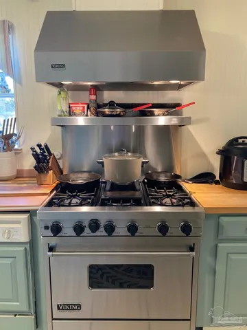 a bathroom with a sink mirror and vanity