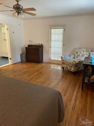 a utility room with dryer washer and a view of living room