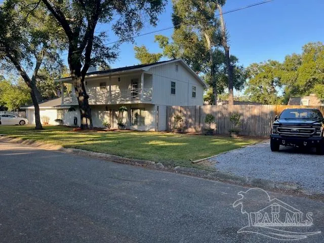 a spacious bedroom with a bed and a table in it
