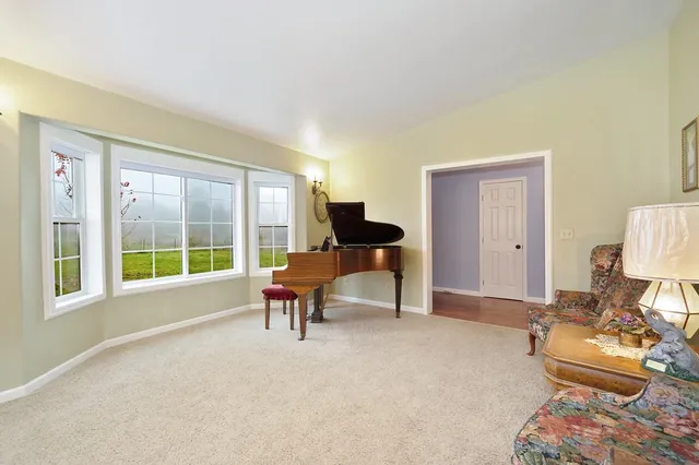 a spacious bedroom with a large bed and a flat screen tv